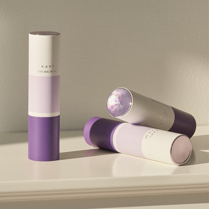 KAHI Eye Balm CV 9g products displayed on a white surface under soft lighting.