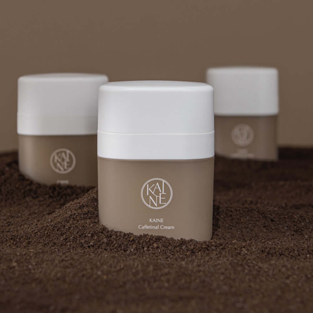 KAINE Caffetinal Cream 50ml jars displayed on a textured surface