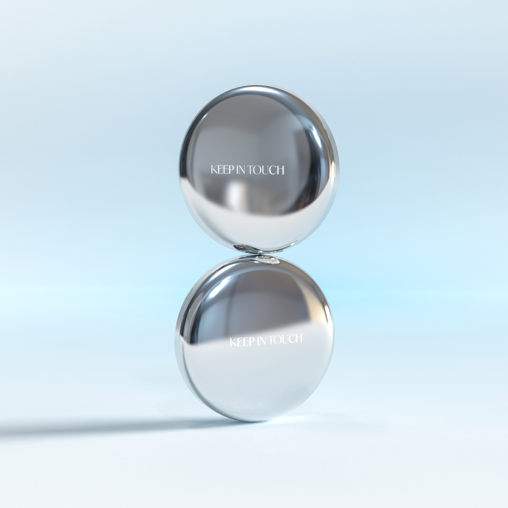 KEEP IN TOUCH Sot Cloud Blur Powder Pact in sleek silver packaging against a light blue gradient background, highlighting elegance.