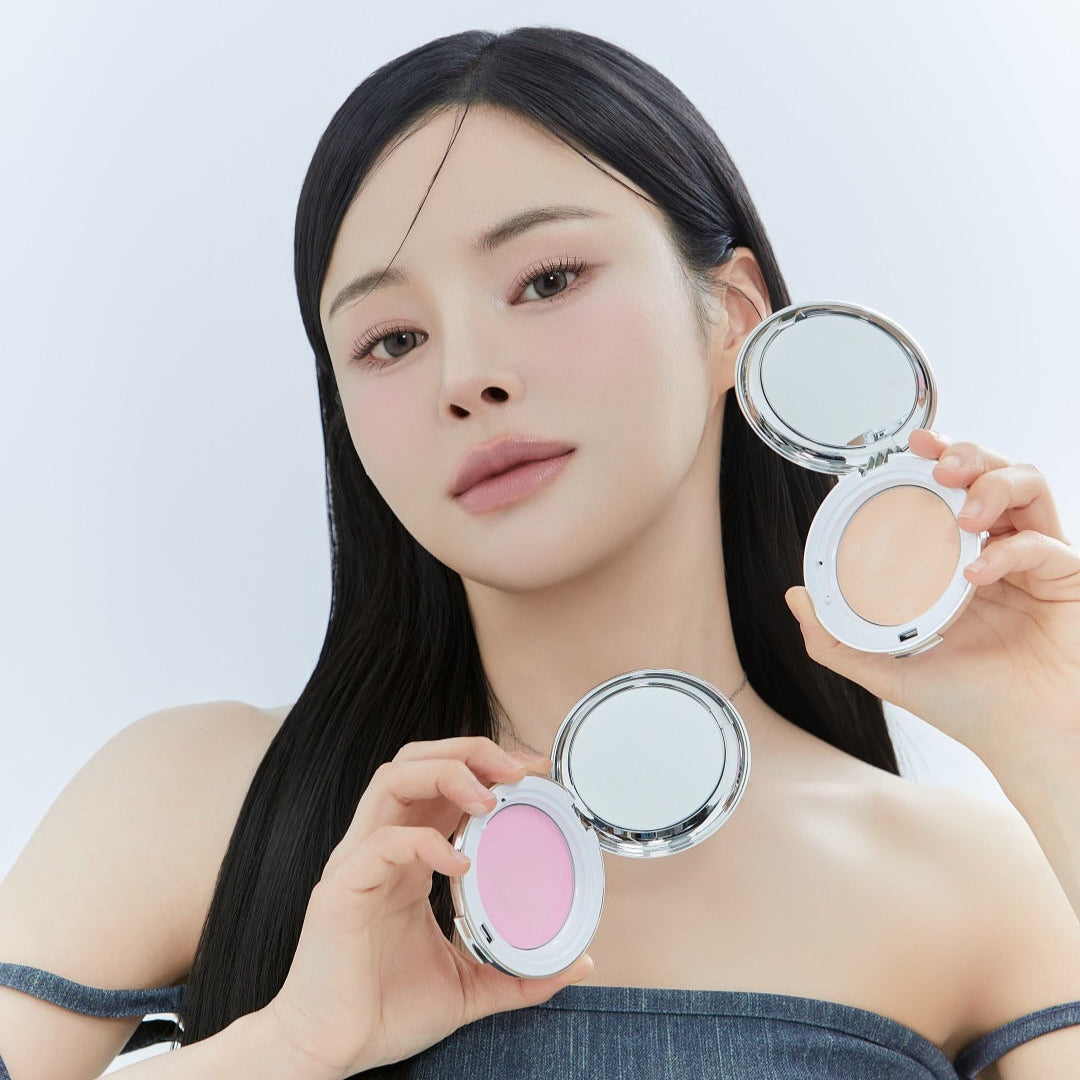 Model showcasing KEEP IN TOUCH Soft Cloud Blur Powder Pact in two shades.