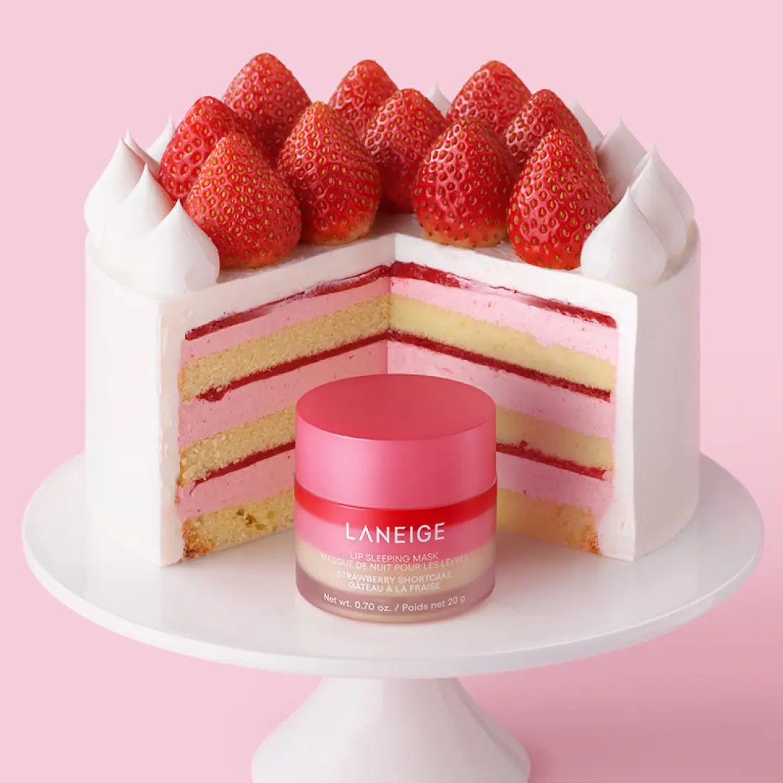 LANEIGE Lip Sleeping Mask EX Strawberry Shortcake 20g in front of a strawberry shortcake