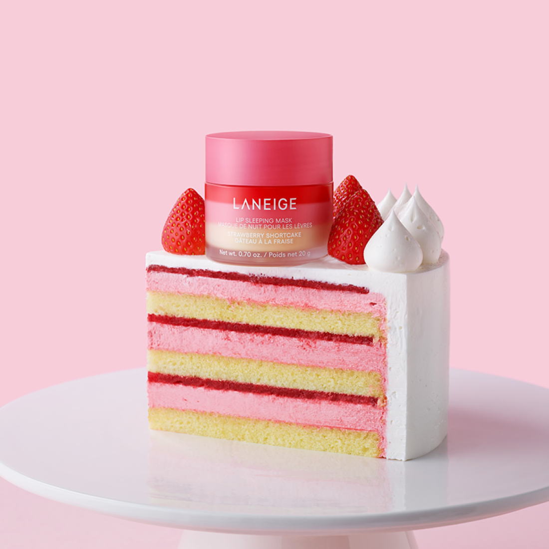 LANEIGE Lip Sleeping Mask EX Strawberry Shortcake 20g displayed on a slice of strawberry cake with a pink background.