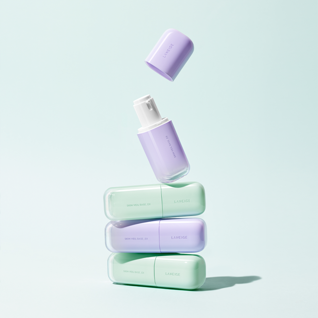 LANEIGE Skin Veil Base SPF28/PA++ 30ml bottles in pastel colors on display.