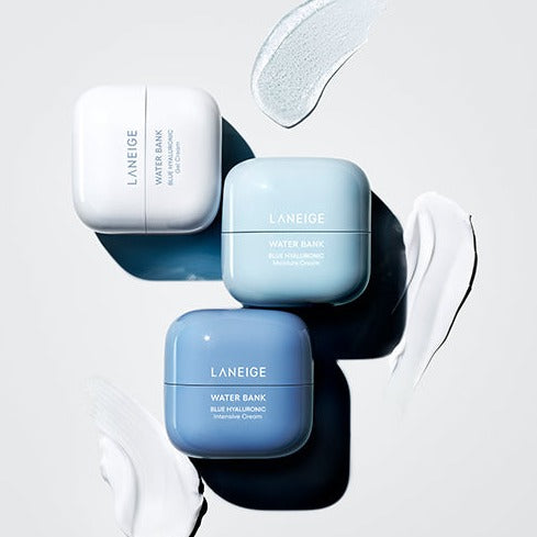 Three jars of LANEIGE Water Bank Blue Hyaluronic Cream 50ml on a light background, showcasing skincare product packaging.