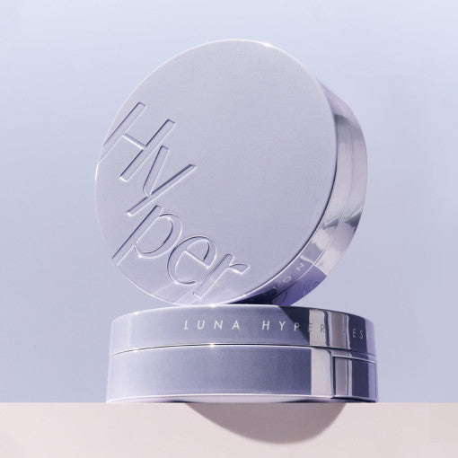 LUNA Hyper Mesh Foundation compact on white surface showcasing sleek silver packaging