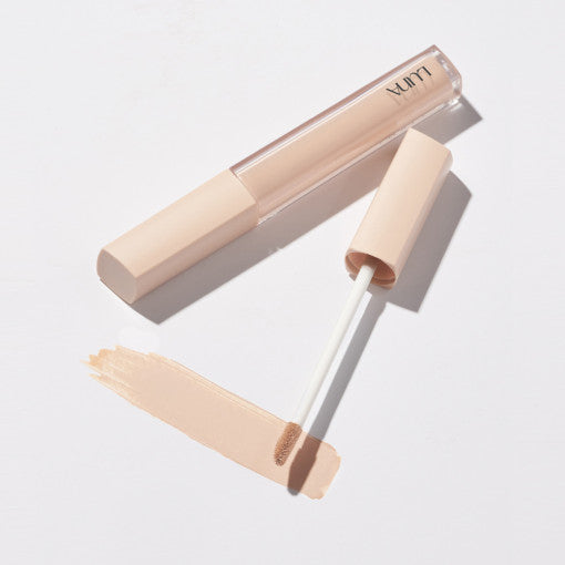 LUNA Long Lasting Tip Concealer Fixing Fit with applicator and swatch on a white background.