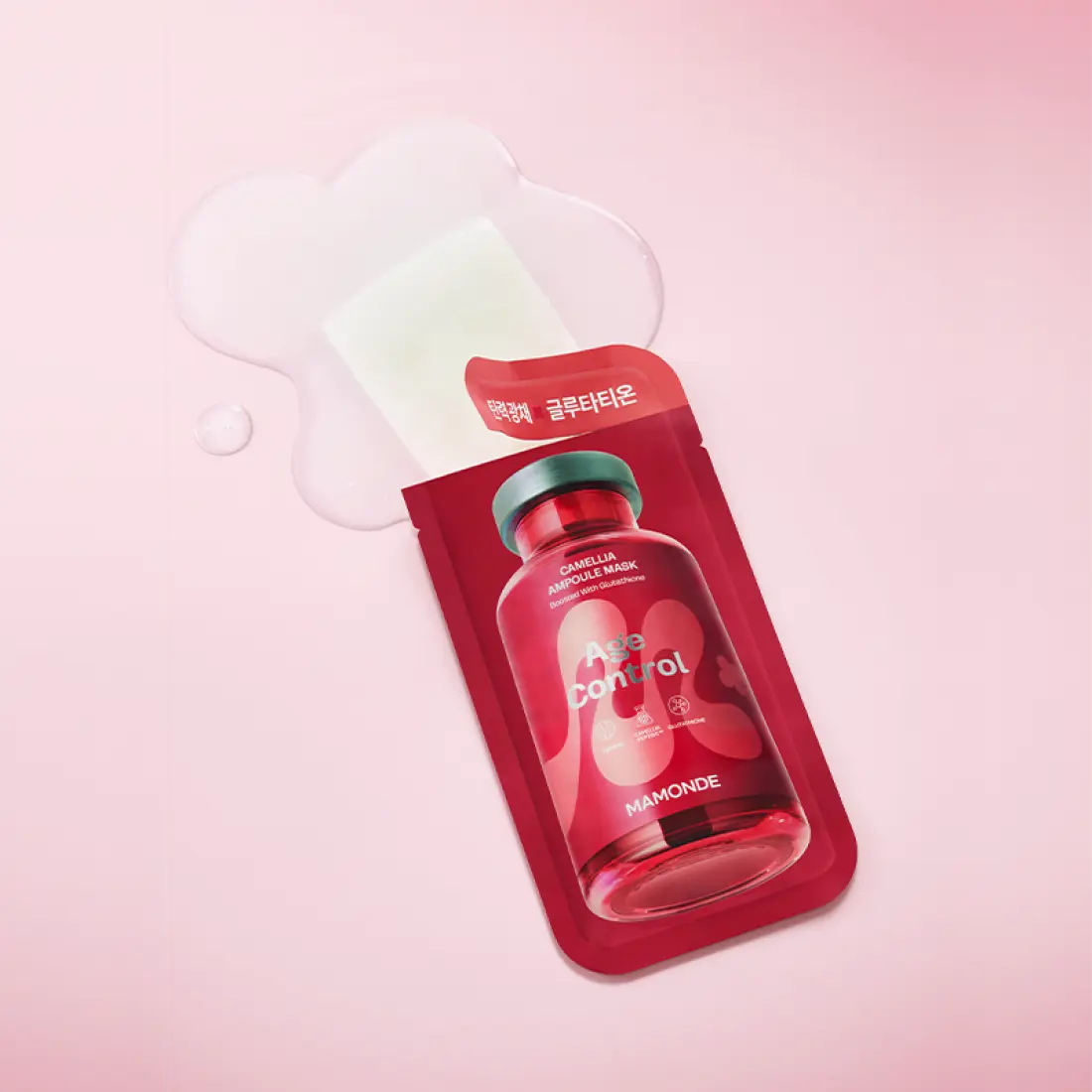 MAMONDE Age Control Camellia Ampoule Mask Pack packaging on a pink background with liquid splashes.