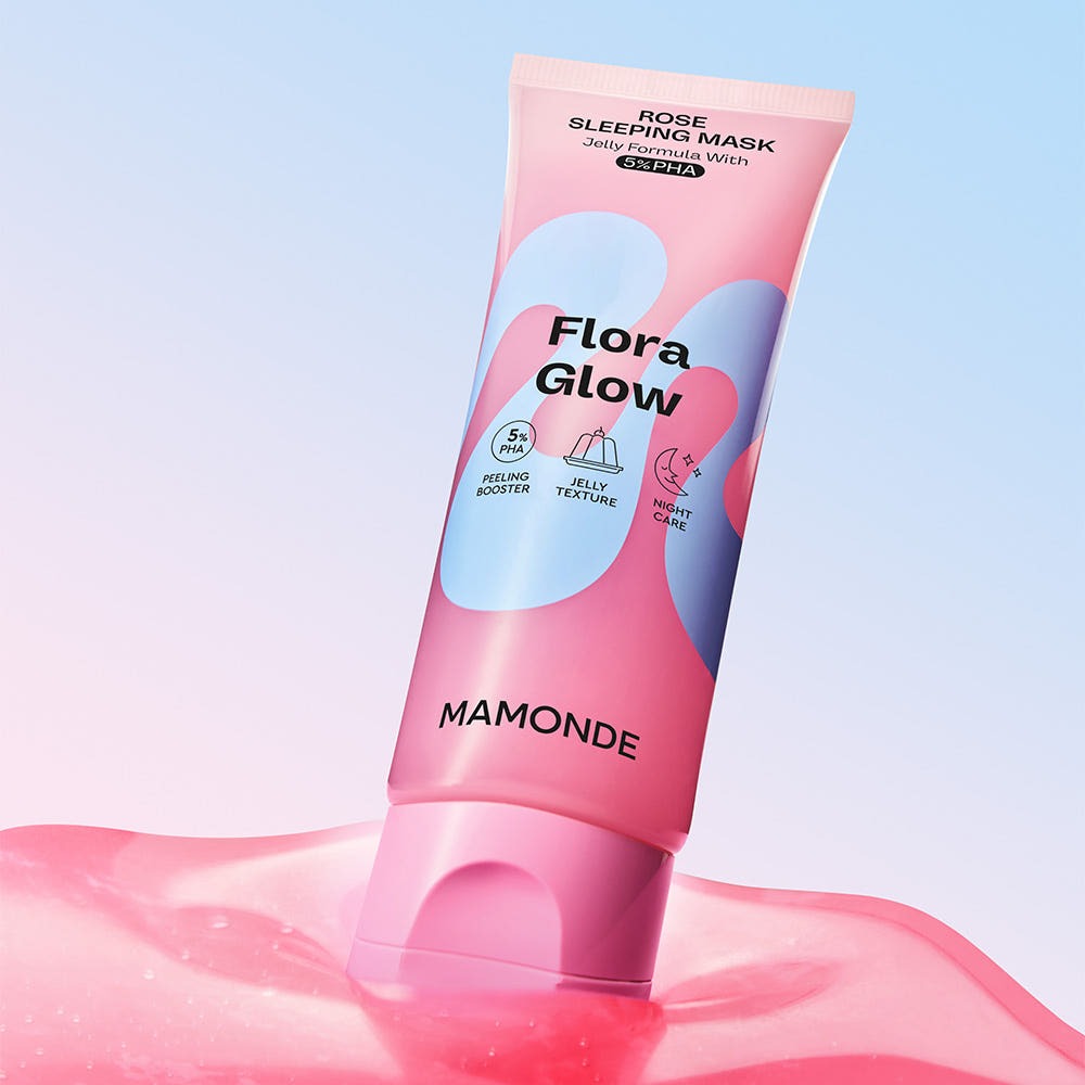 MAMONDE Flora Glow Rose Sleeping Mask 80ml product packaging with pink and blue design, displayed on a glossy surface.