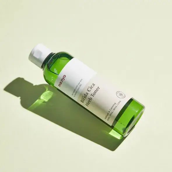 MANYO Bifida Cica Herb Toner 210ml bottle on light background. Skincare product ideal for soothing and hydrating skin.