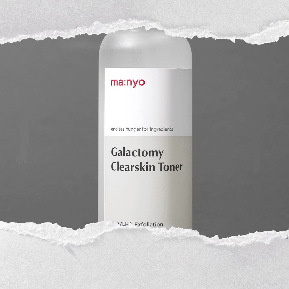 MA:NYO Galactomy Clearskin Toner 210ml bottle on torn paper background.