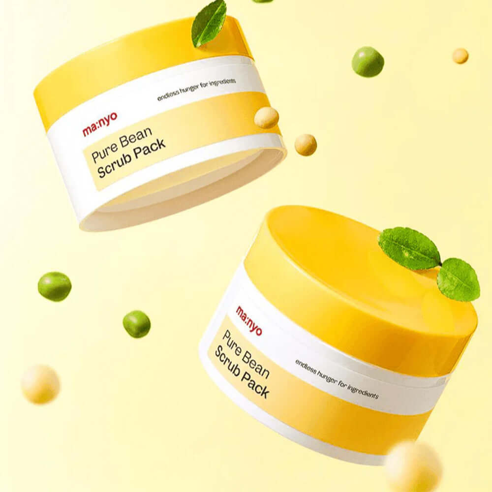 MANYO Pure Bean Scrub Pack 100ml in yellow container with scattered beans and leaves, enhancing skincare routine.