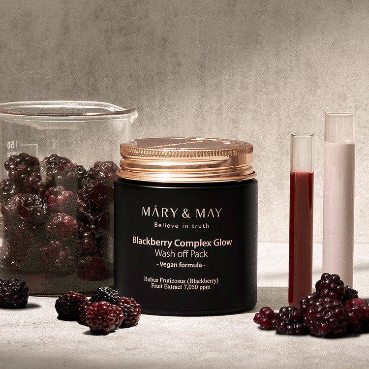MARY & MAY Blackberry Complex Glow Wash off Pack 125g with natural blackberry extracts in elegant jar next to fresh berries.