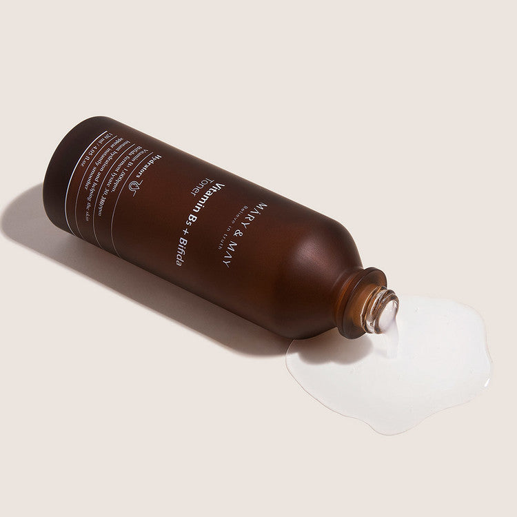 MARY & MAY Vitamin B5 + Bifida Toner 120ml bottle spilling liquid beauty product