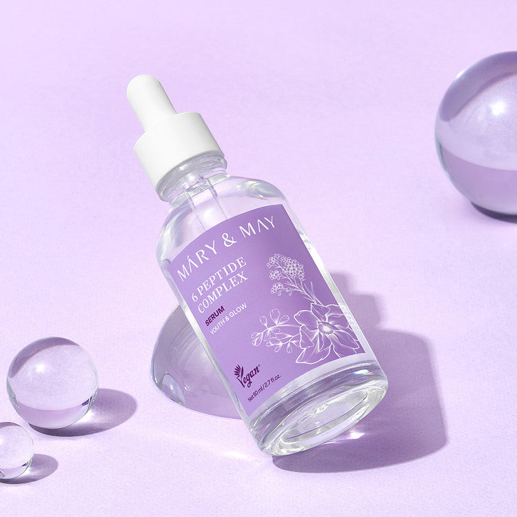 MARY&MAY 6 Peptide Complex Serum 80ml bottle on purple background with clear spheres