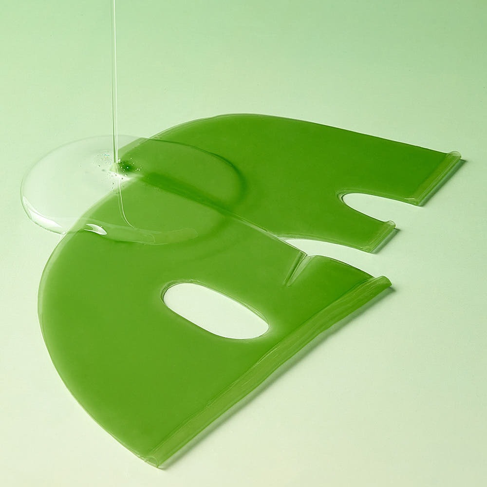 Green gel mask from MARY&MAY Vegan Collagen Fresh Aloe Gel Mask (4 sheets) shown with aloe gel on a green background