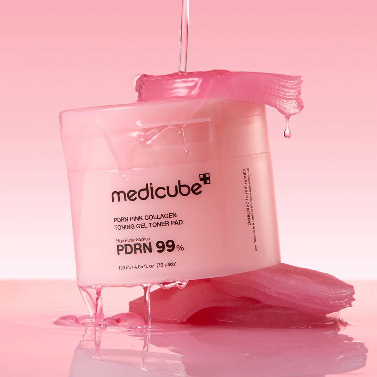 MEDICUBE PDRN Pink Collagen Toning Gel Toner Pad 70pads showcasing product packaging on a pink background.
