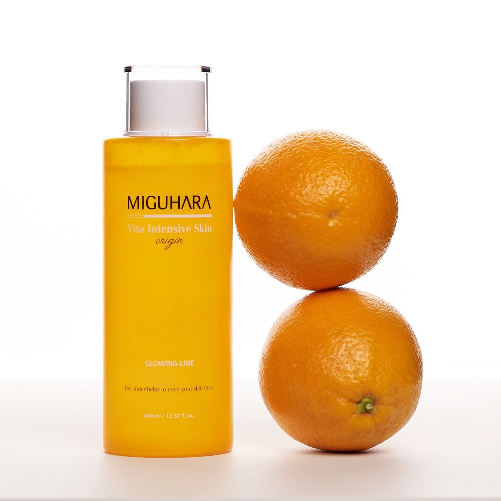 MIGUHARA Vita Intensive Skin Origin 400ml with two oranges, skincare product for glowing skin.