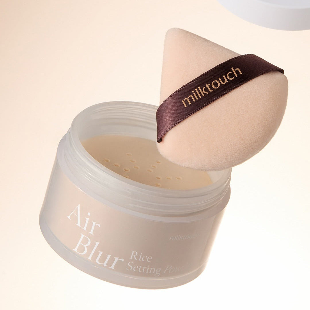 MILK TOUCH Air Blur Rice Setting Powder with applicator for smooth, flawless finish.