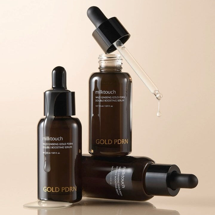 MILK TOUCH Ginseng Gold PDRN Double Boosting Serum 30ml in glass bottles with droppers showcasing luxury skincare.