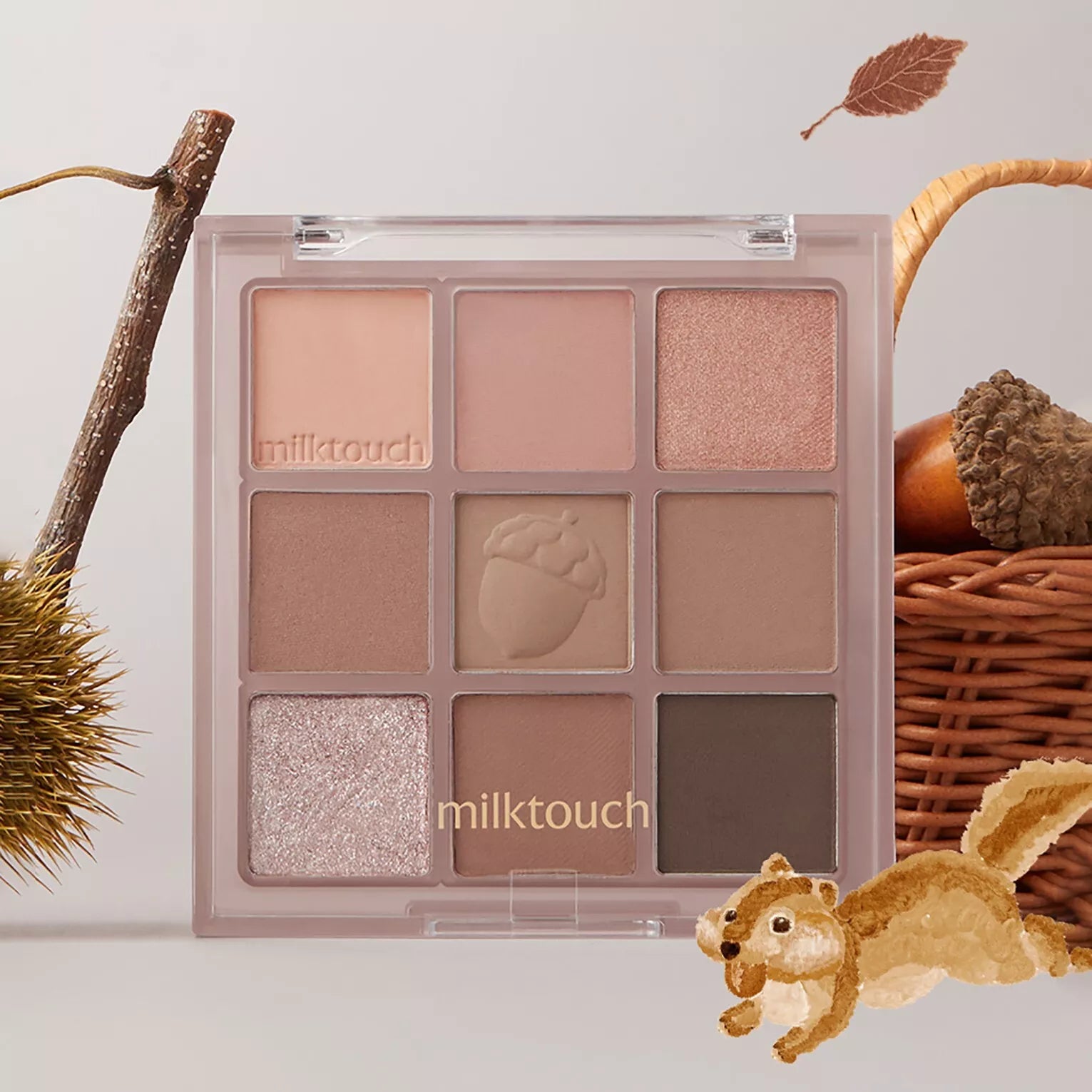 MILK TOUCH Tone On Shadow Palette featuring various natural shades with a decorative squirrel and autumn elements.