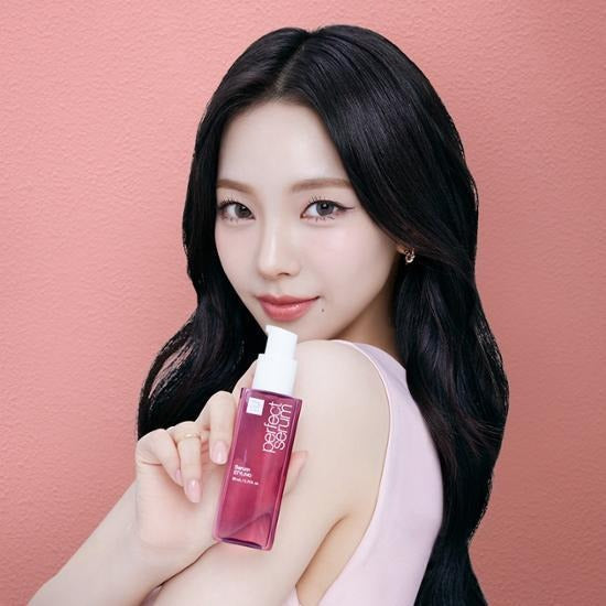 MISE EN SCENE Perfect Serum 80ML held by woman on pink background, showcasing hair care product packaging.