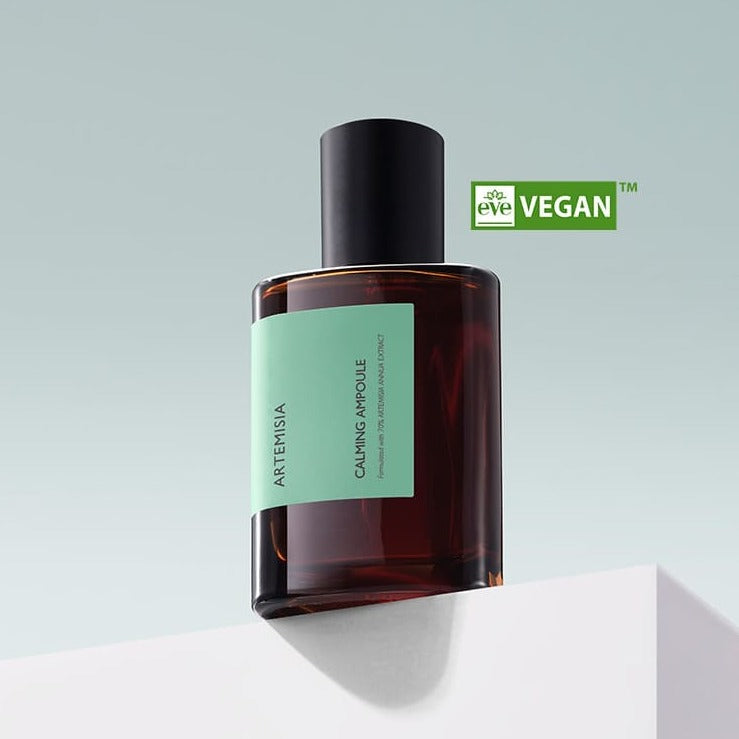 MISSHA Artemisia Calming Ampoule 75ml bottle on a white surface with vegan certification.