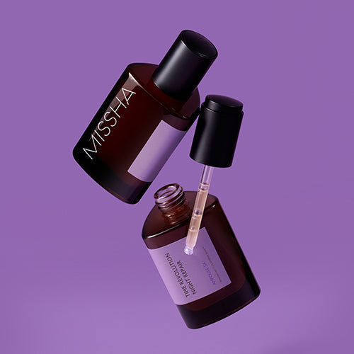 MISSHA Time Revolution Night Repair Ampoule 5X 75ml serum bottle on a purple background