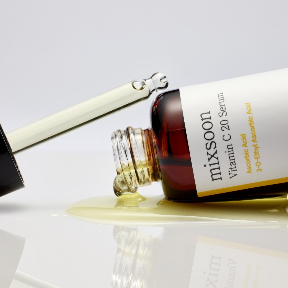 MIXSOON Vitamin C 20 Serum 10ml bottle with dropper spilling serum, showcasing product label and texture.