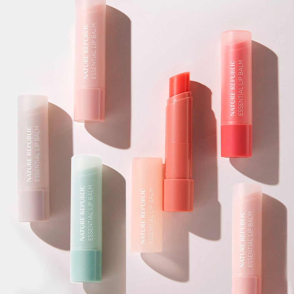 NATURE REPUBLIC Essentail Lip Balm collection showcasing various shades and packaging on a light background.