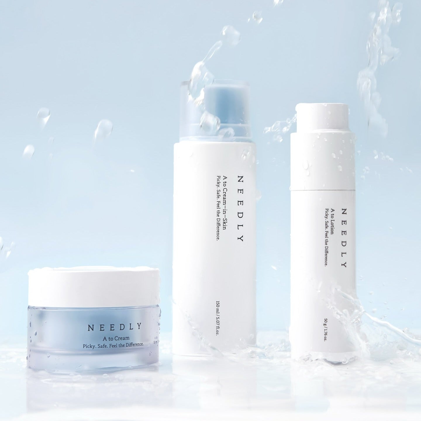 NEEDLY A to Cream Skin 150ml product packaging with water splash on a blue background, highlighting skincare qualities.