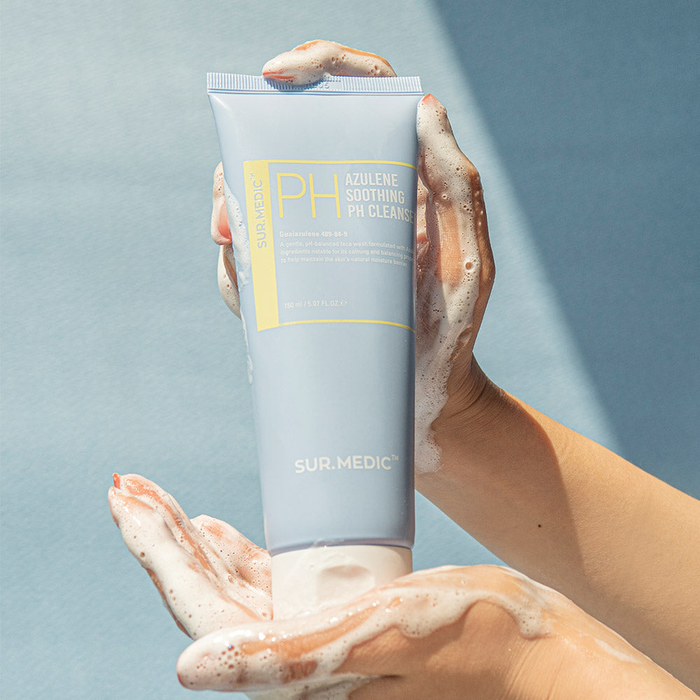 Hands holding NEOGEN Azulene Soothing Midly Acidic Cleanser 150ml with foam lather.