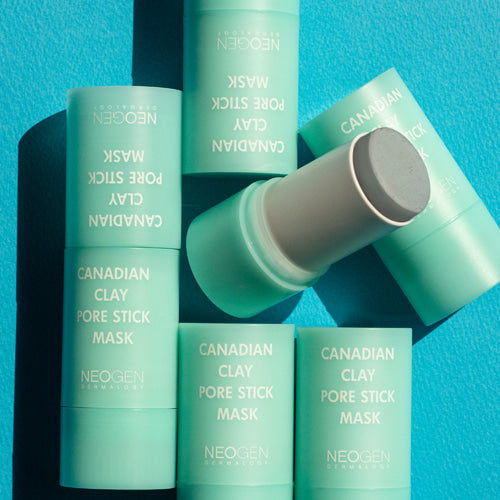 NEOGEN Canadian Clay Pore Stick Mask 28g packaging on a blue background.