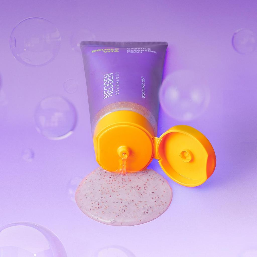 NEOGEN Dounble Viita Capsual Cleansing Foam 150ml spilling on a purple background
