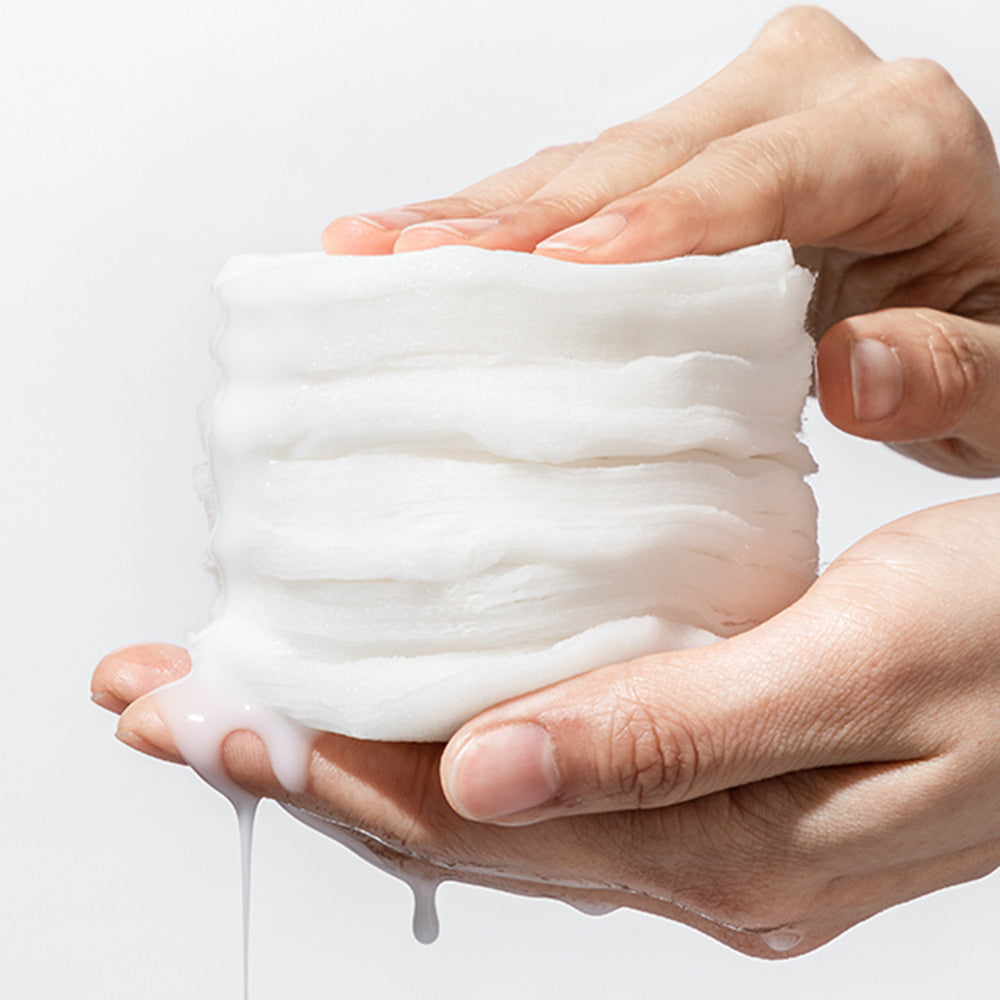 Person holding NEOGEN Niacinamide Glow Up Daily Mask Pads 40 Sheets showing texture and moisturizing essence.