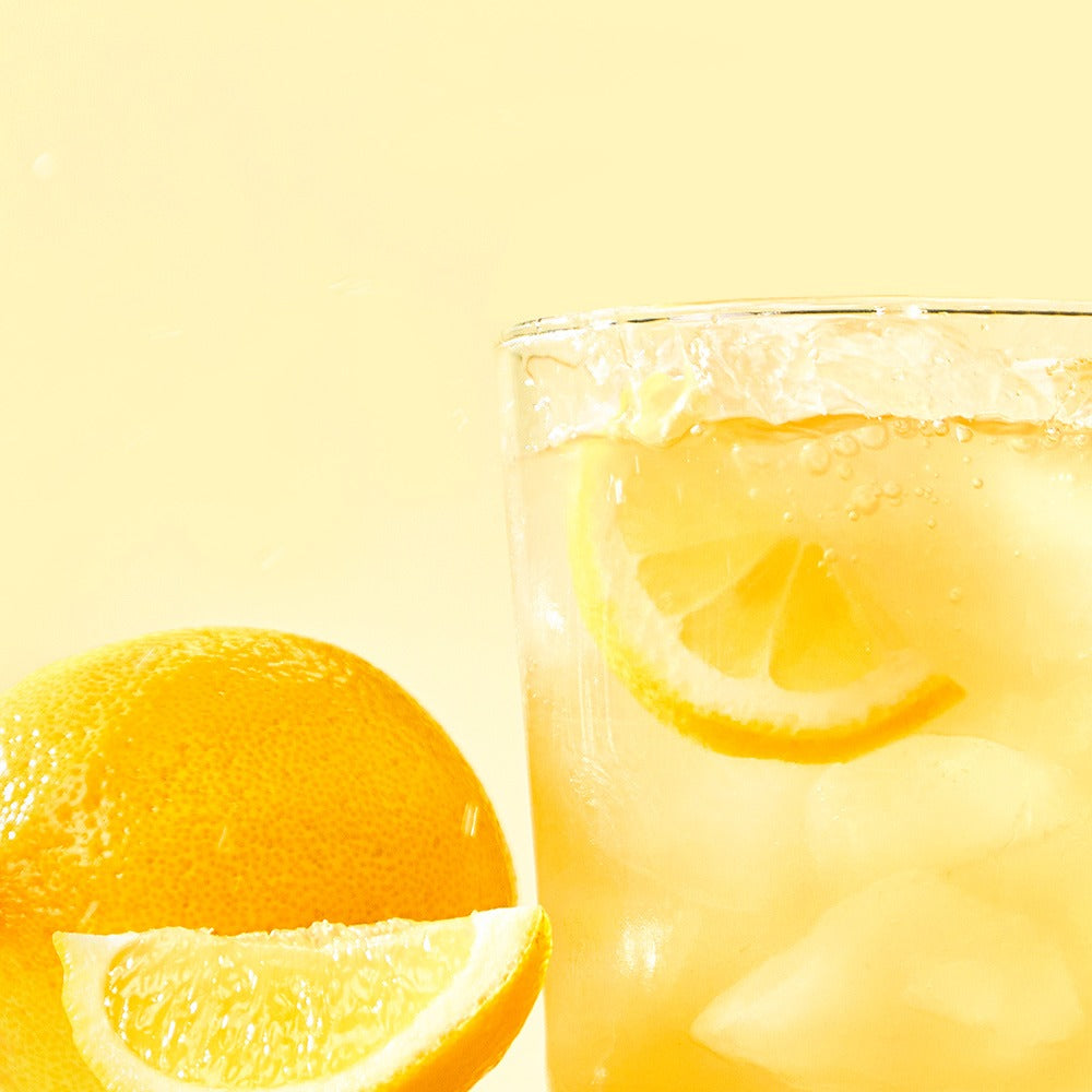 NOTHING BETTER Inner Juice 100% Lemon Cleanse Juice 100ml (X24) with fresh lemon slices and ice in a refreshing beverage