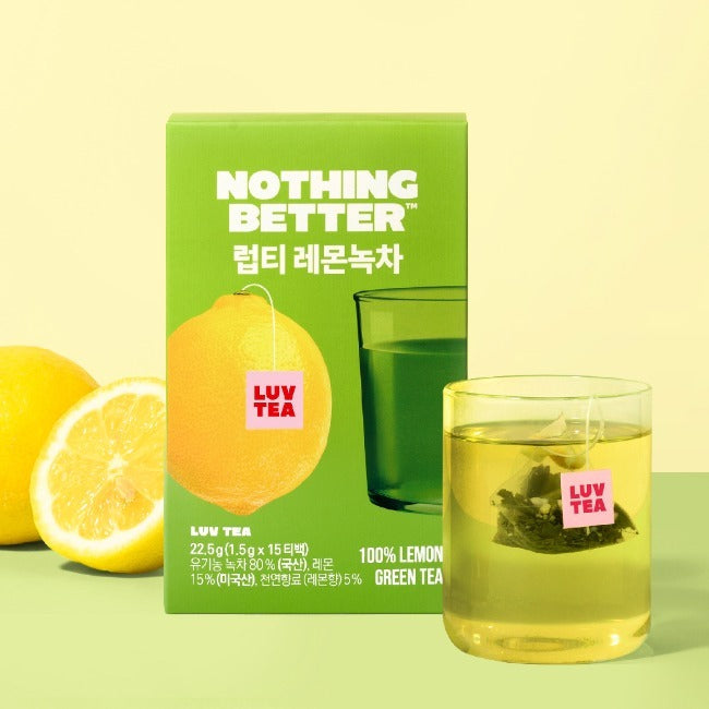 NOTHING BETTER Luv Tea Lemon Green Tea (X15) package with fresh lemons and a cup of brewed green tea on a yellow background.