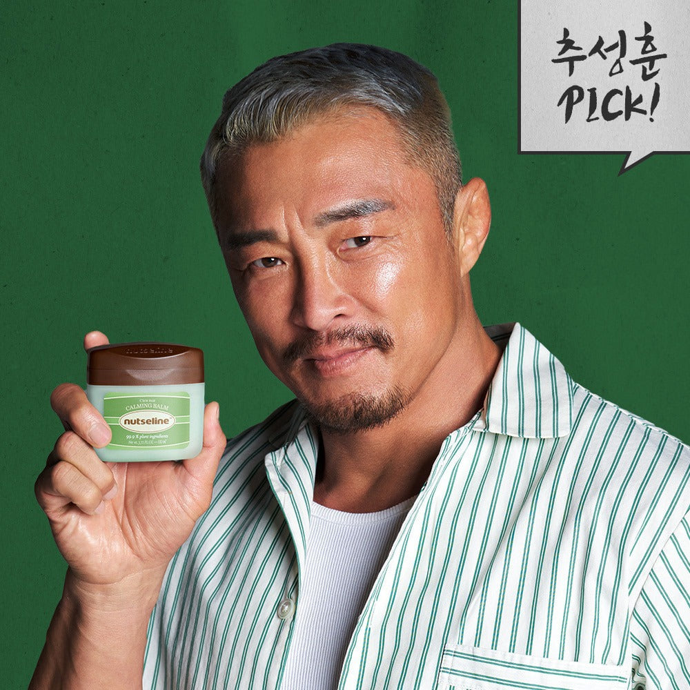 Man holding NUTSELINE Cica Nut Calming Balm Season 2 50ml with green background