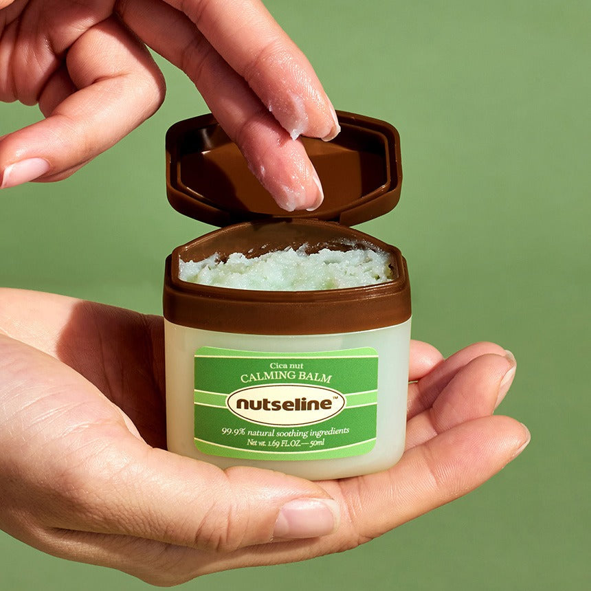 Person holding NUTSELINE Cica Nut Calming Balm Season 2 50ml