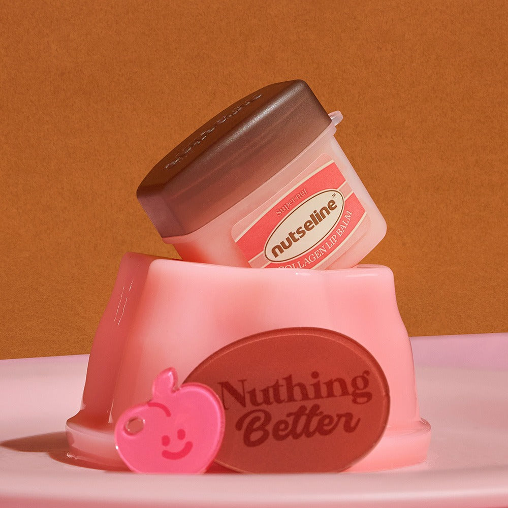 NUTSELINE Super Nut Collagen Keyring Lip Balm 11ml displayed with pink and brown accessories