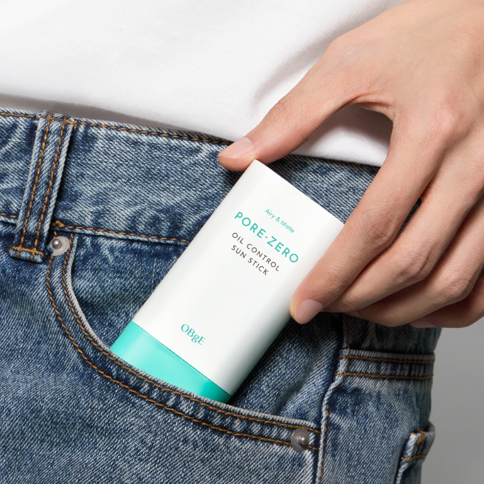OBGE Pore Zero Oil Control Sun Stick held by a gentleman in jeans pocket — Gentleman Korea men’s oil-control sunscreen stick