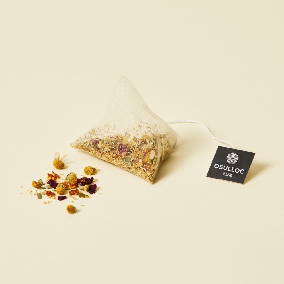 OSULLOC Chamomile Blend 10 p herbal tea bag with loose chamomile and floral ingredients on display.