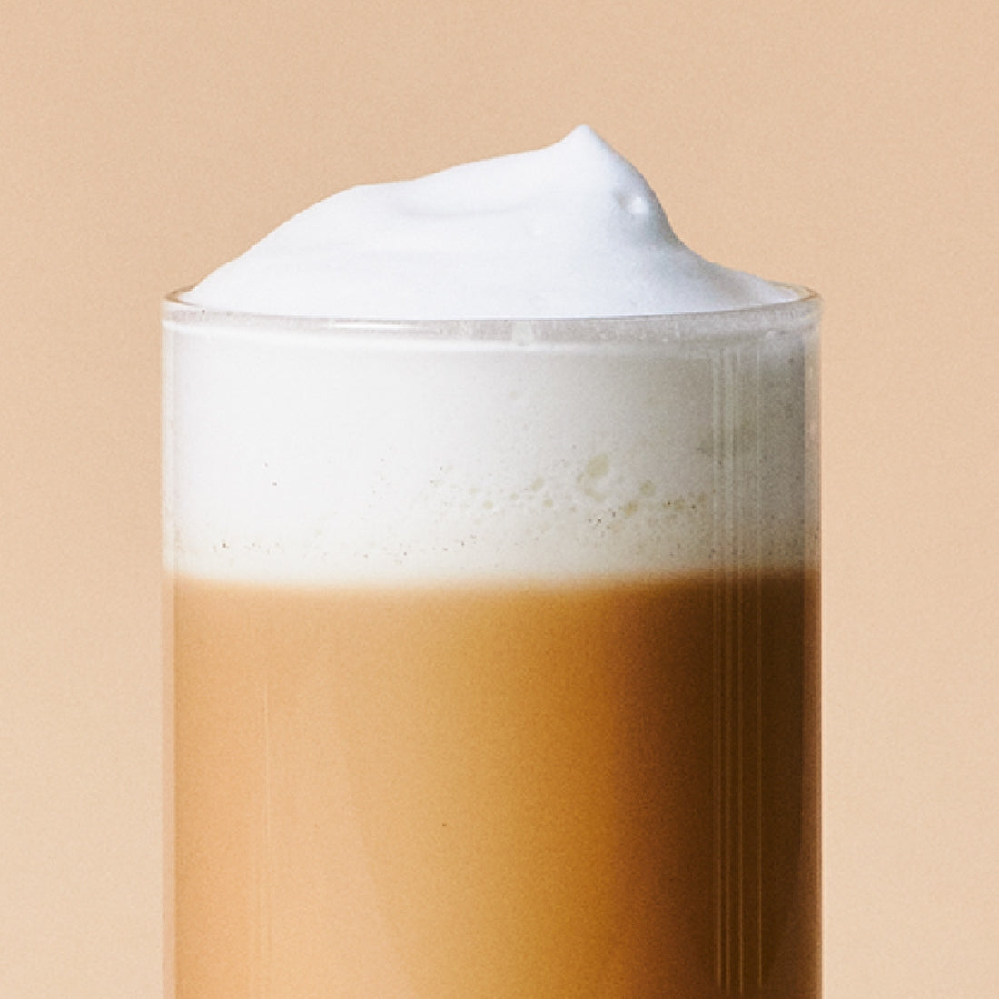 Creamy OSULLOC Earl Grey Milk Tea 10 p in a glass with frothy top.