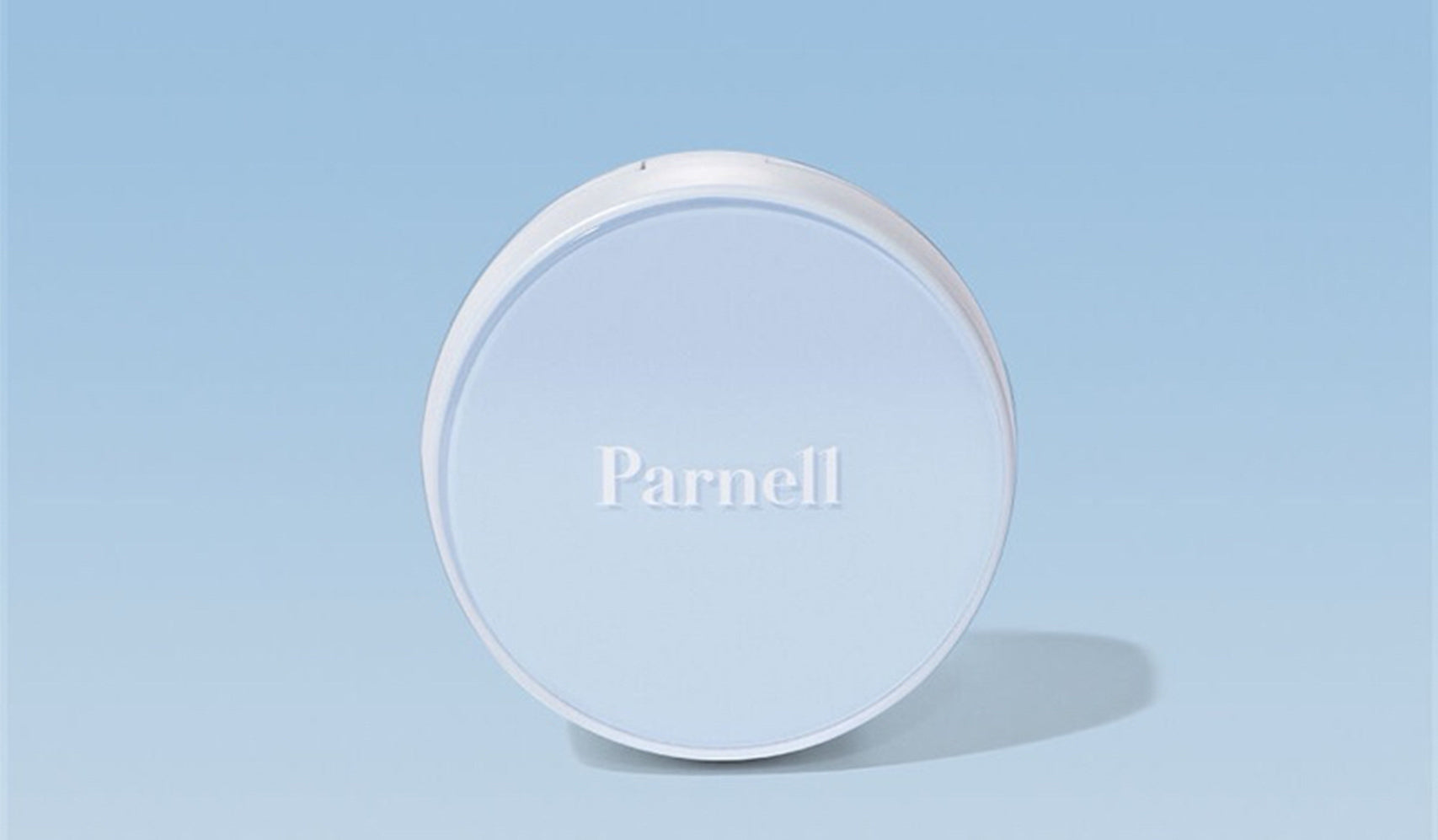 Round white container with 'Parnell' branding against a light blue background.
