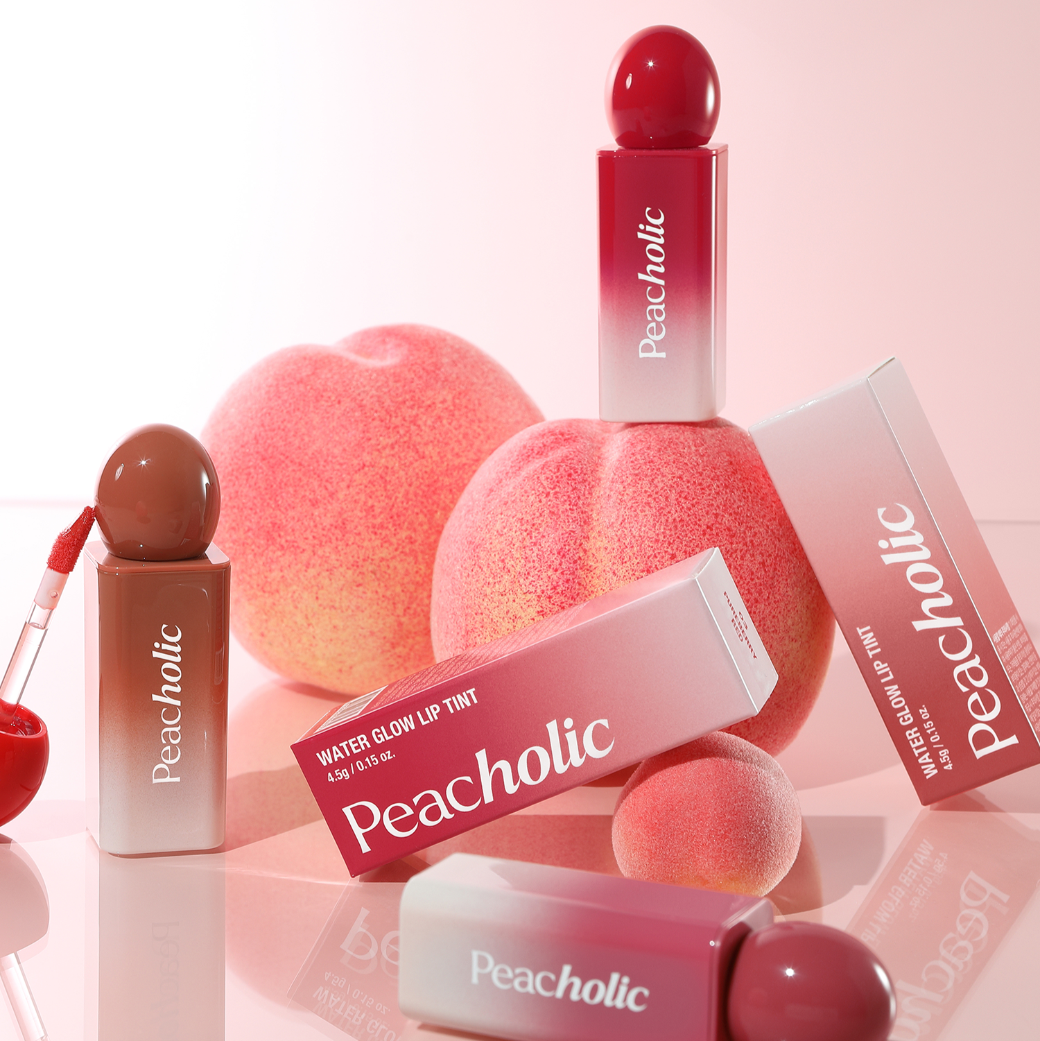 PEACHOLIC Water Glow Lip Tint in various shades with product packaging and peach background.