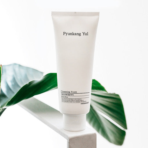 PYUNKANG YUL Cleansing Foam 150ml displayed with a green leaf background