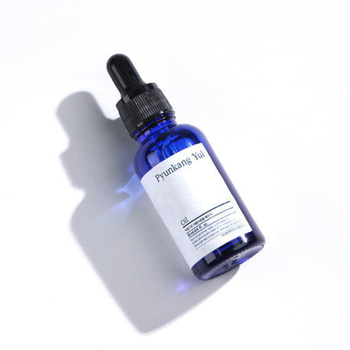 PYUNKANG YUL Oil 26ml face oil in blue bottle, lightweight and antioxidant-rich for youthful, radiant skin.
