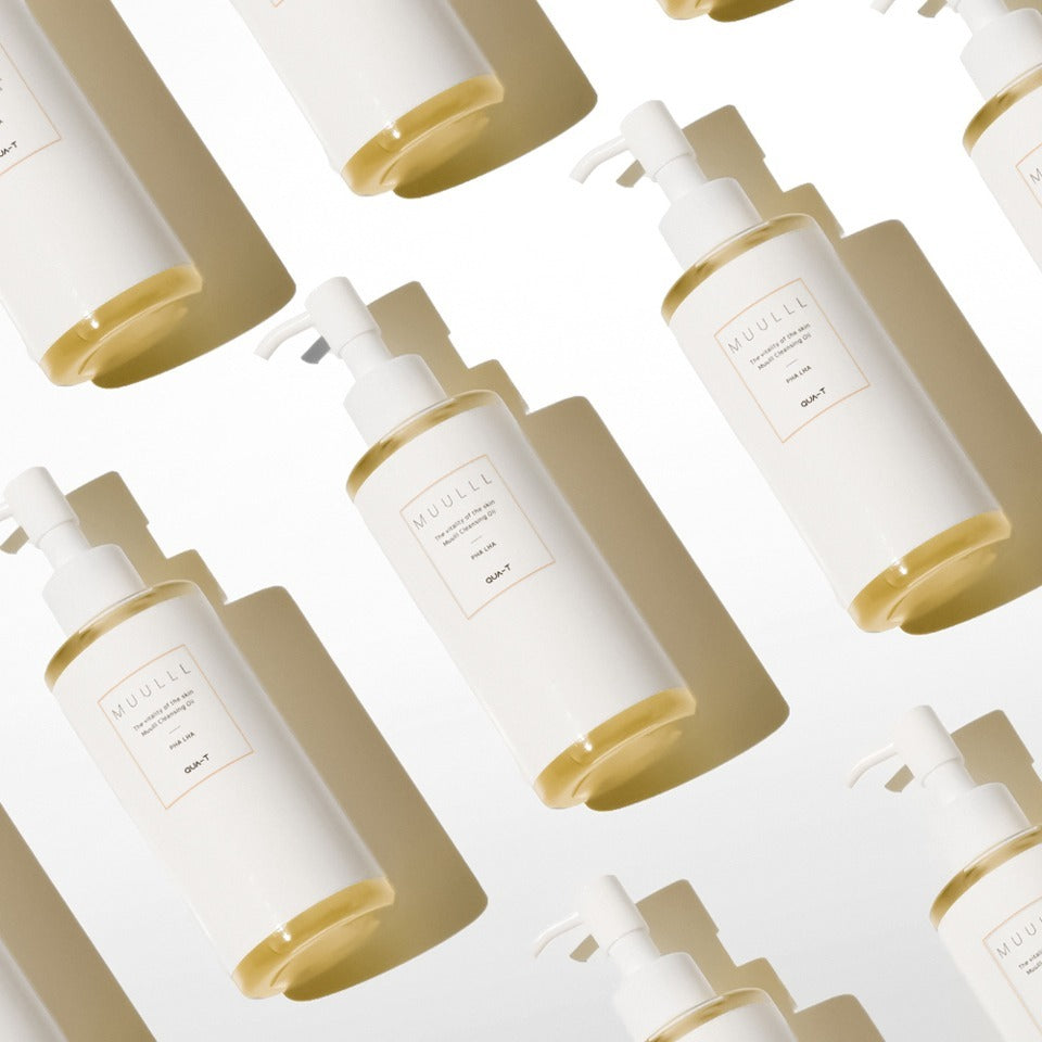 Pattern of QUA-T Cleansing oil 200ml bottles, skincare product emphasis.