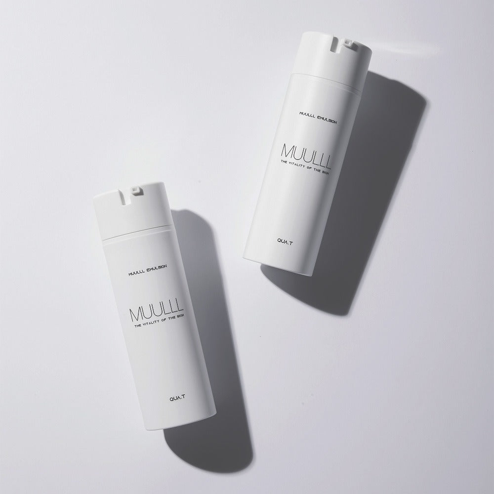 Two bottles of QUA-T Emulsion 150ml placed on a light surface.
