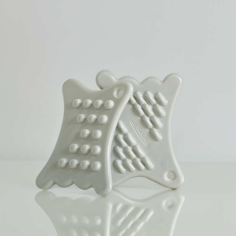 RETURNITY Mini Guasha tool with textured design for massage and skincare.