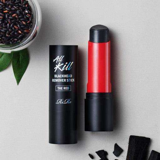 RIRE All Kill Blackhead Remover Stick The Red in open packaging on a light background with charcoal pieces and leaves.